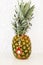 Red evil eye necklace advertisement on pineapple