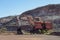 Red excavator in Tom Price iron ore mine in Pilbara region which can be seen at tour