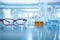 Red eye glasses in science laboratory background with flask