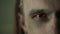 Red eye of pagan man. Close up