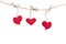 Red fabric hearts hanging on the clothesline