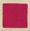 Red fabric napkin on wooden wall