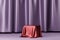 Red fabric placed on podium or pedestal for products or advertising near to purple curtains.