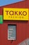 a red facade with the brand of Takko. Takko is a German textile discounter chain