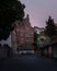 The red facade of a majestic building in the old town of the university city Lund, Sweden, during night time