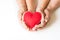 Red felt heart in childs and mens hands on white. View from above. Copy space.