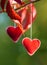 Red felt hearts hanging on strings. Beautiful wedding background. Valentines