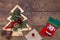 Red felt stocking and metallic golden fir tree with branches and cones, Christmas decorations, beads and gifts wrapped in paper on