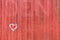 Red fence/wall with heart drawing