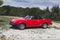Red Fiat 124 spider, classic Italian sport car from 70s and 80s