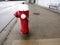 A red fire hydrant, faucet or fire hydrant, a water intake to provide a flow rate in the event of a fire. Water can be obtained fr