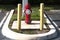 Red Fire hydrant in parking lot with safety poles