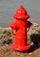 Red fire hydrant by road