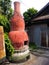 Red fire place and chimney for joss papers burned.