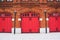 Red Fire Station doors on red brick wall building