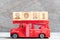 Red fire truck hold block in word 2021 on wood background