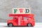 Red fire truck hold block in word FWD Abbreviation of forward on wood background