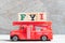 Red fire truck hold block in word FYI Abbreviation of For your information on wood background