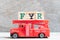 Red fire truck hold block in word FYR abbreviation of for your reference on wood background