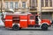 Red fire truck stands on the street near an old building in Sukhumi
