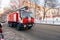 Red firetruck IVECO speeding down a street to a call in Samara,