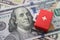 Red first aid bag suitcase toy on US dollar bill banknotes background with copy space. Expense for healthcare , medical, hospital