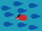 The red fish swims in the opposite direction from the other fish. Courage and confidence. business difference