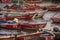 Red fisherÂ´s empty boats anchored in AntofagastaÂ´s harbour with different names and numbers and white and blue interior.