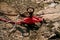 Red fisherman rope tied to a hook, close up