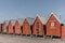 Red fishermens huts in a row at the harbour of Faaborg, Denmark
