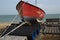 Red fishing boat out of the water