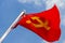 A red flag with communist symbols of a sickle