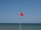 red flag at sea