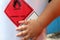 red flammable symbol of chemical and children hand