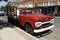 Red Flatbed Ford on The Corner, Taking It Easy. Eagles Iconic Location. Winslow, Arizona, USA. June 12, 2014.