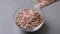 red Flattened rice in a bowl on gray background