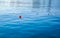 A red floating ball in the sea