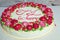 Red flower cake. Be happy . Round yellow cake