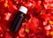 Red flower  essential oil in a brown bottle. BACH therapy