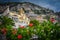 Red flowers with church background in Positano village