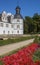 Red flowers in front of the Neuhaus castle in Paderborn