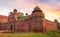 Red Fort Delhi historic red sandstone fort at sunset with moody sky