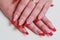 Red french nail art with rhinestones