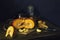 Red French pumpkin, slices, brown pottery, apples. On a blue background.