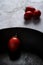 Red fresh healthy tomatoes isolated on a black pan