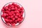 Red fresh ripe raspberry in a bowl. Summer concept