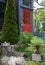 Red front door on a classic shingle style house