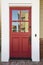 Red front door on an upscale home
