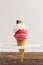 red frozen ice scoop with with whipped cream chocolate cone. High quality photo