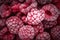 Red frozen raspberries background. Close up, berry background